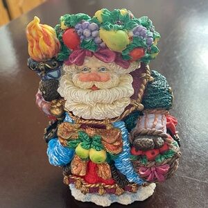 Festive Santa Claus Figurine with Fruit Accents